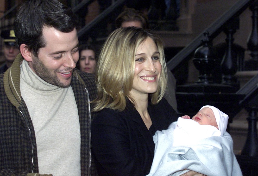 Sarah Jessica Parker (R) and husband actor Matthew Broderick arrive home with their newborn son, James Wilke Broderick