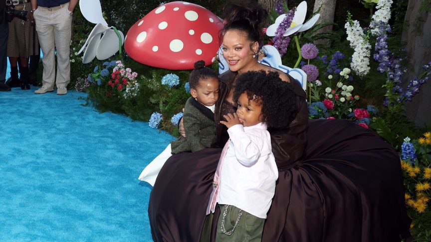 Rihanna poses with sons RZA and Riot at the “Smurfs” U.S. premiere in Los Angeles