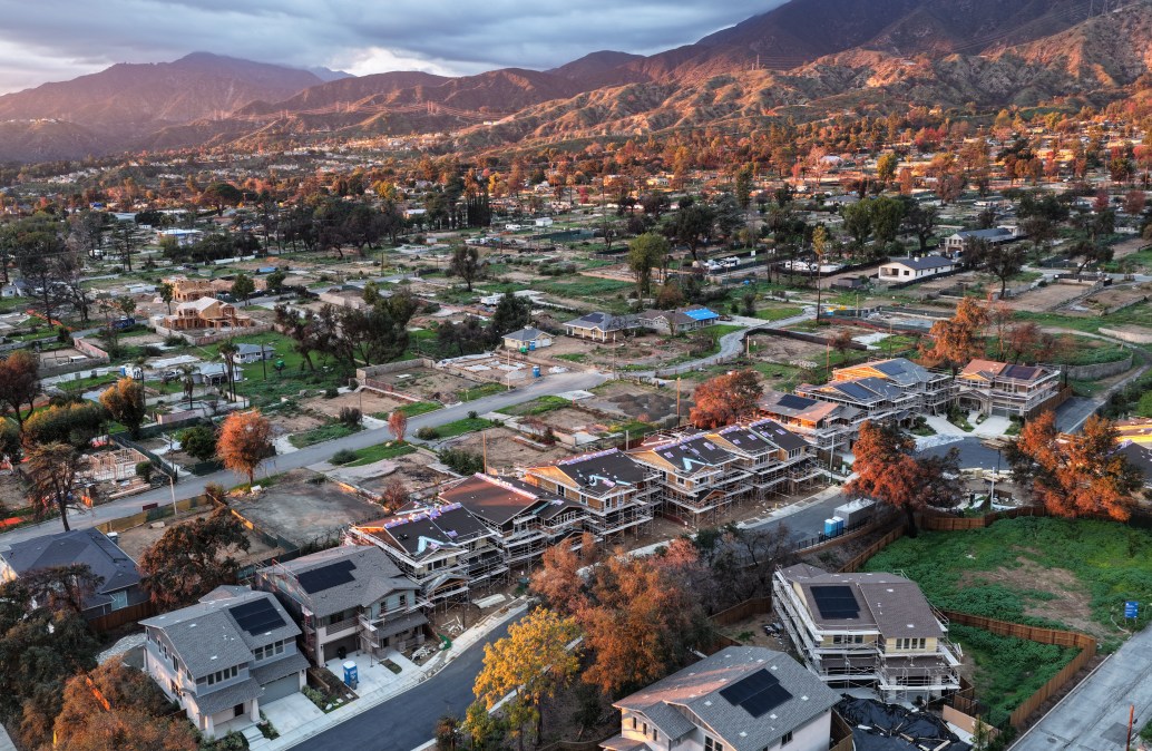 An aerial view of construction of 16 new homes at a planned community amid cleared lots where homes were destroyed by the Eaton Fire on January 5, 2026 in Altadena, California.