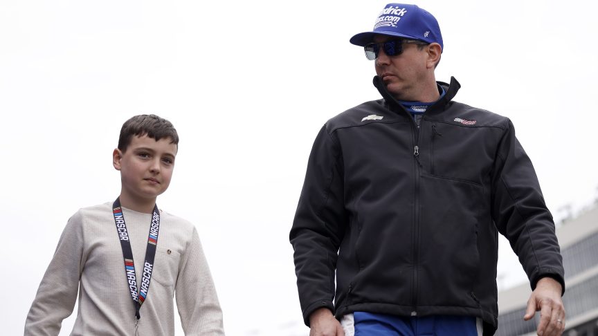 Kyle Busch walks with son Brexton Busch before a NASCAR Craftsman Truck Series race at EchoPark Speedway in February 2026.