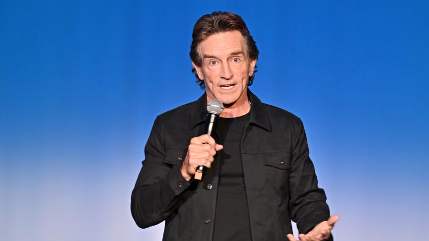 Jeff Probst speaking onstage at a “Survivor 50” event in New York City.
