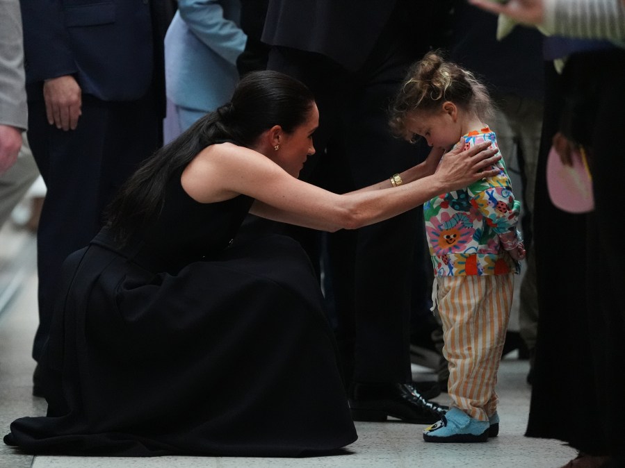 Meghan Markle with a child.