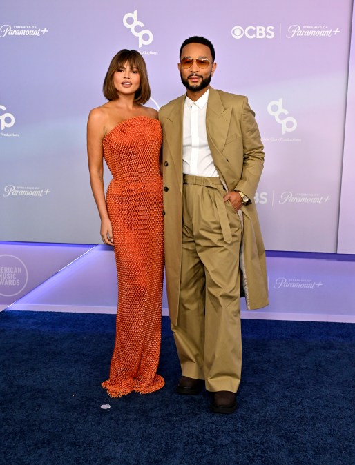 Chrissy Teigen and John Legend on the American Music Awards of 2026 red carpet.