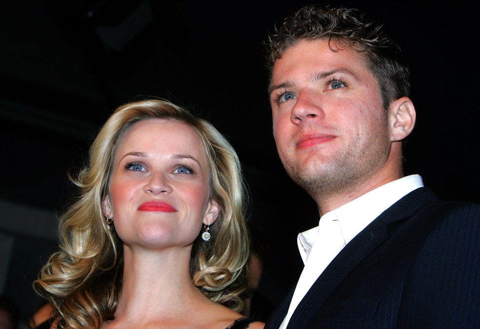 Actress Reese Witherspoon (L) and her husband Ryan Phillippe