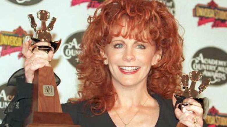 Reba McEntire holds two Academy of Country Music Awards which she won for "Entertainer of the Year" and "Top Female Vocalist" 10 May in LOs Angeles. The awards were held at Universal City. AFP PHOTO