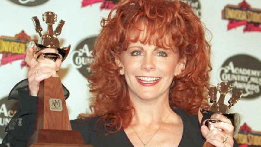 Reba McEntire holds two Academy of Country Music Awards which she won for "Entertainer of the Year" and "Top Female Vocalist" 10 May in LOs Angeles. The awards were held at Universal City. AFP PHOTO