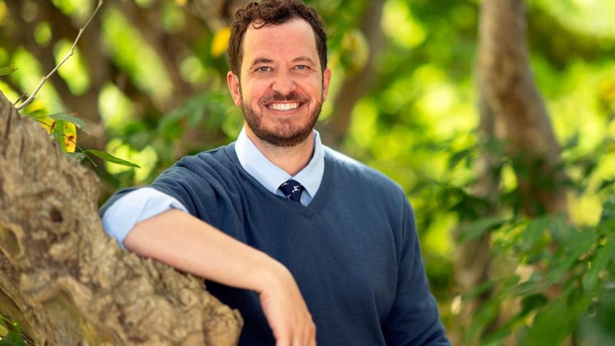 Rick Devens smiles in a promotional portrait for “Survivor 50”