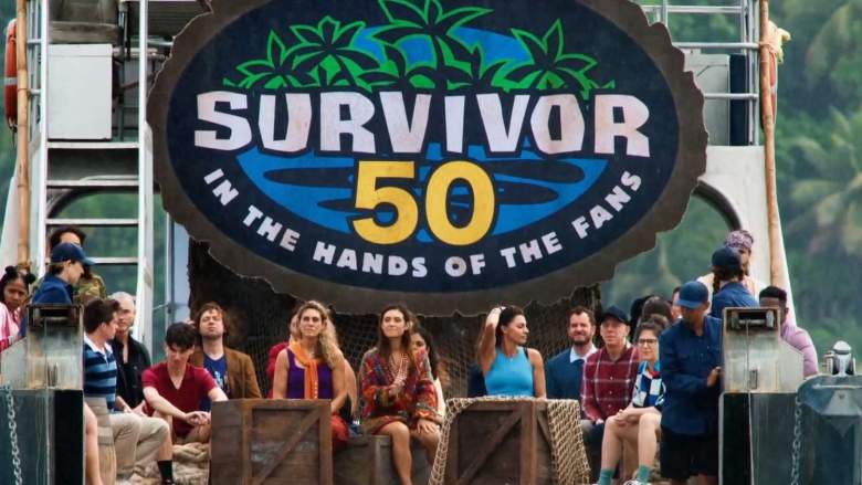 The cast of “Survivor 50” poses together in an official promotional group photo.