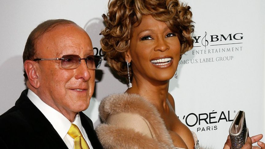 Music mogul Clive Davis and singer Whitney Houston arrive at the Clive Davis pre-Grammy party held at the Beverly Hilton on February 10, 2007 in Beverly Hills, California