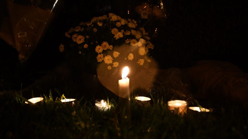 Flowers and candles for David Daker.