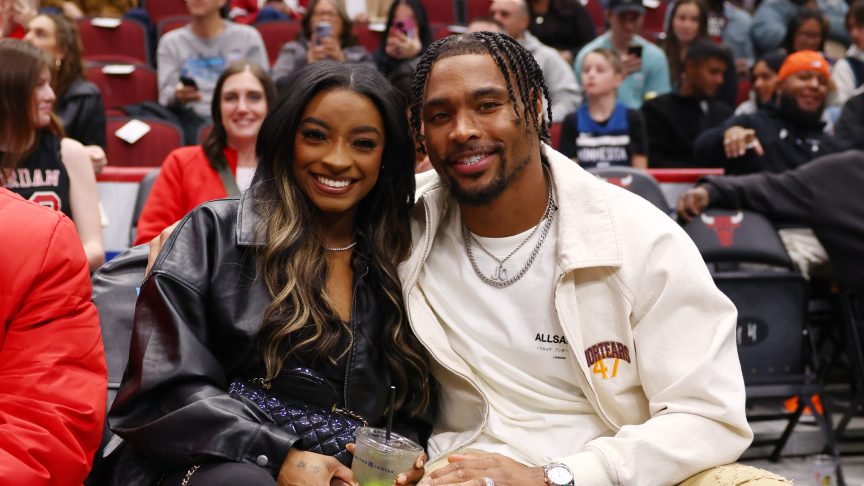 Simone Biles and Jonathan Owens pose for a photo during the first half between the Chicago Bulls and the Minnesota Timberwolves at the United Center on November 07, 2024 in Chicago, Illinois.
