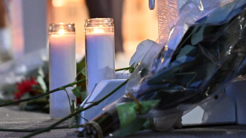 Candles and flowers for Justin Cary.