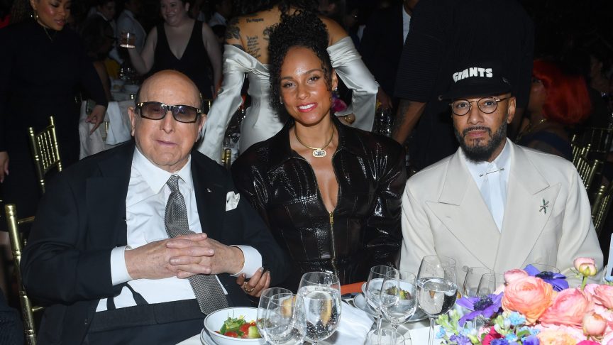Clive Davis sits with Alicia Keys and Swizz Beatz at the Gordon Parks Foundation Awards Dinner in New York City.