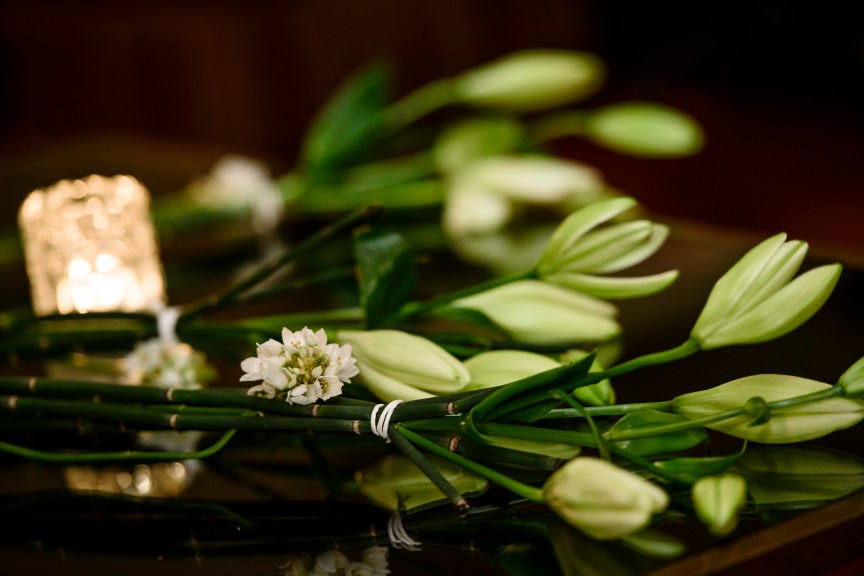 Flowers and candle for Dexter Wansel.