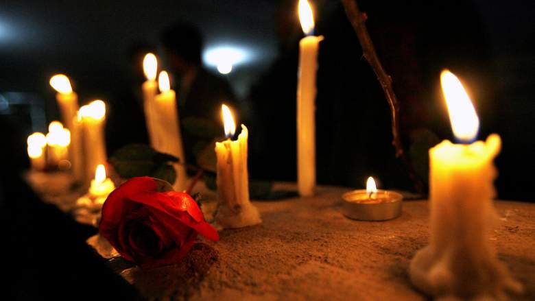Candles and a rose for Jeff Olson.