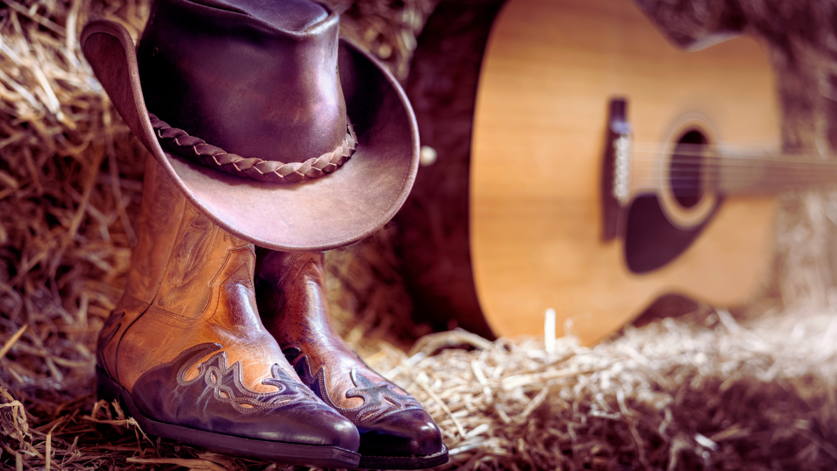 cowboy boots, hat and guitar
