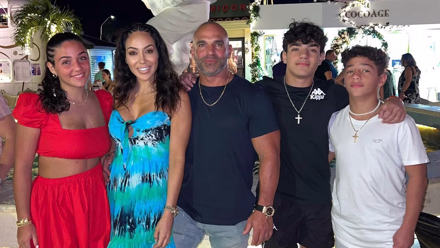 Melissa Gorga and Joe Gorga pose with their children Antonia, Gino and Joey during a family celebration.