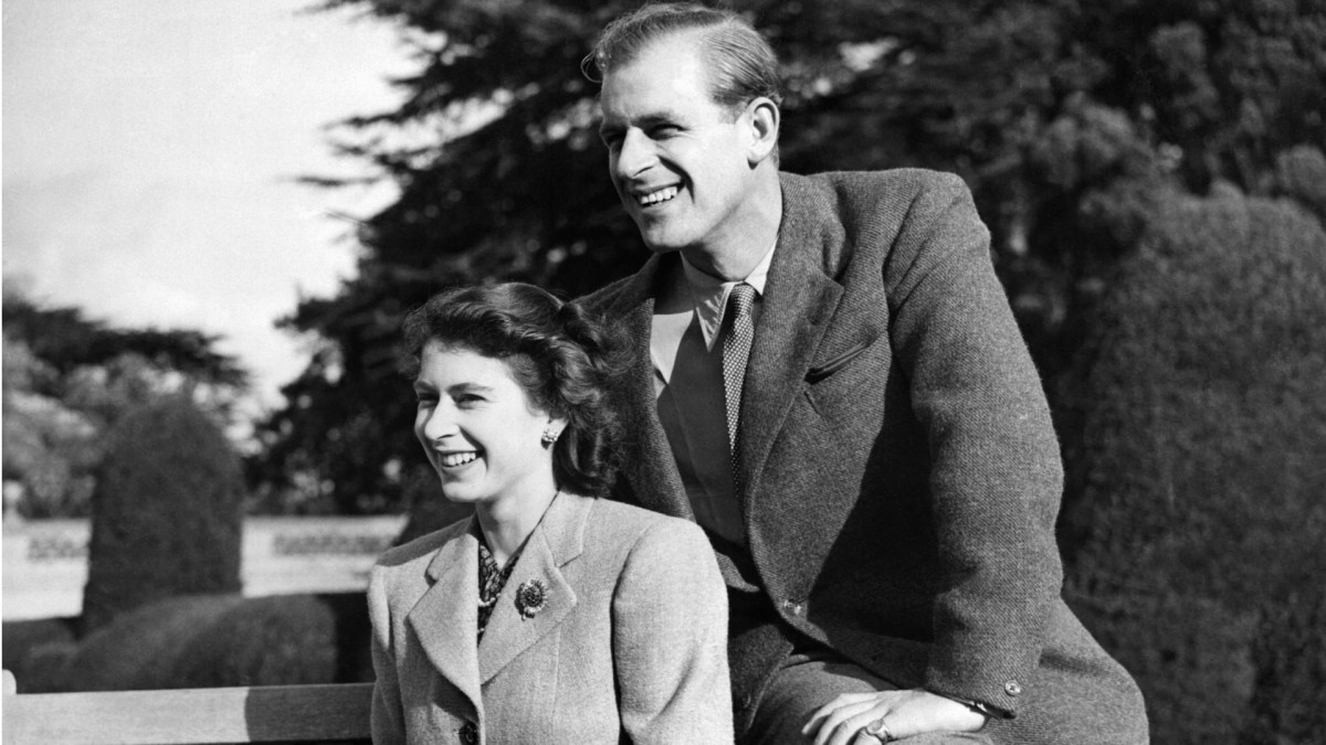 Queen Elizabeth and Prince Philip smiling for the camera