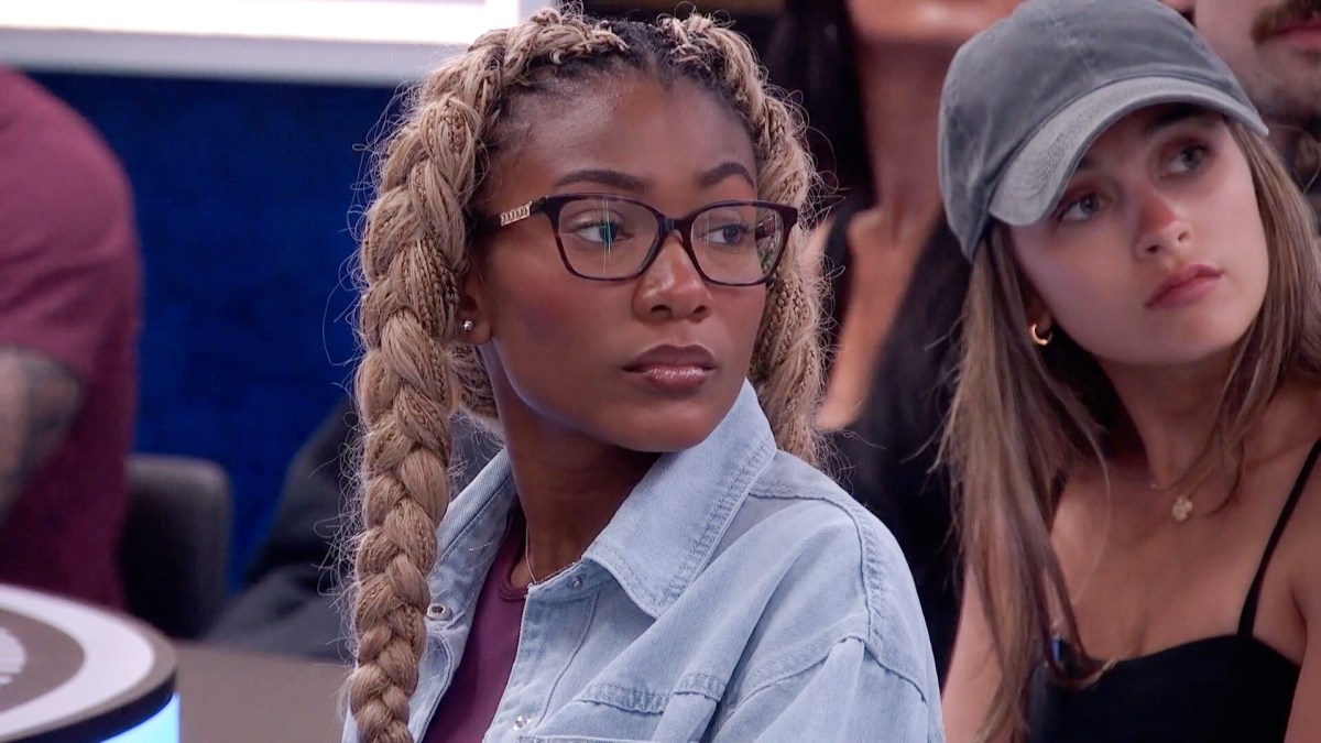 Taylor Brown sits in the dining room with the 'Big Brother 28' cast.