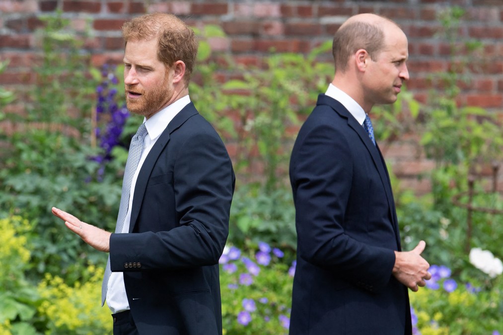 Britain's Prince Harry, Duke of Sussex (L) and Britain's Prince William, Duke of Cambridge attend the unveiling of a statue of their mother, Princess Diana at The Sunken Garden in Kensington Palace, London