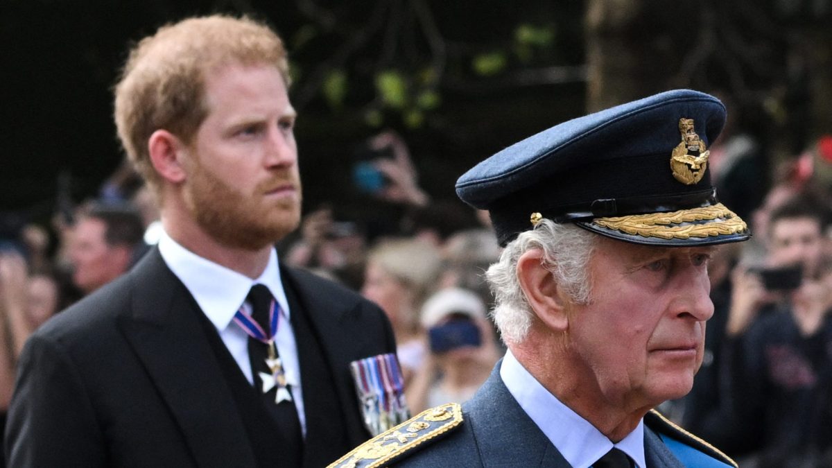 Britain's King Charles III and Britain's Prince Harry, Duke of Sussex, walk behind the coffin of Queen Elizabeth II, adorned with a Royal Standard and the Imperial State Crown and pulled by a Gun Carriage of The King's Troop Royal Horse Artillery, during a procession from Buckingham Palace to the Palace of Westminster, in London.