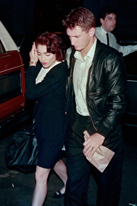 Us singer Madonna and her husband Sean Penn enter their Manhattan apartment on May 13, 1988, after Penn attended his wife's performance of "Speed the Plow". (Photo by Ron J. Haviv / AFP via Getty Images)