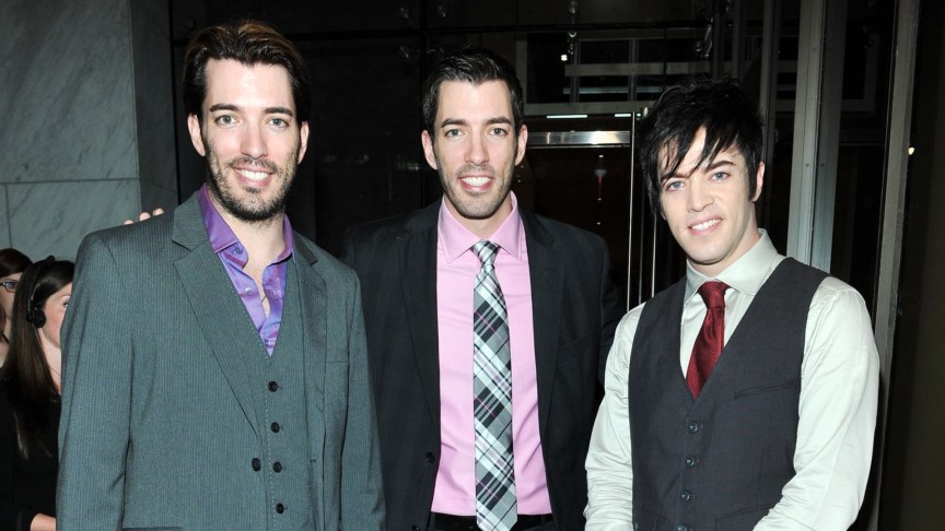 Drew Scott and Jonathan Scott posing with brother J.D. Scott.