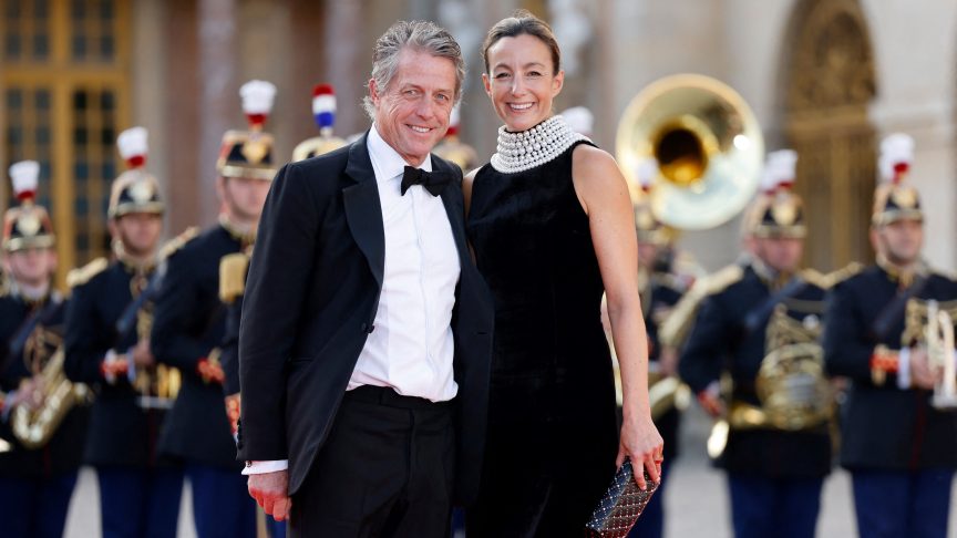 English actor Hugh Grant and his Swedish producer wife, Anna Eberstein, arrive to attend a state banquet at the Palace of Versailles on the first day of a British royal state visit to France. Britain's King Charles III and his wife Queen Camilla are on a three-day state visit to France.