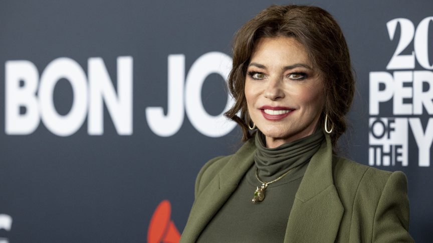 Shania Twain smiling on the red carpet