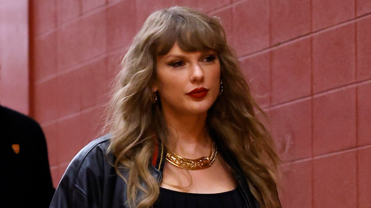 Taylor Swift on her way into a football game.
