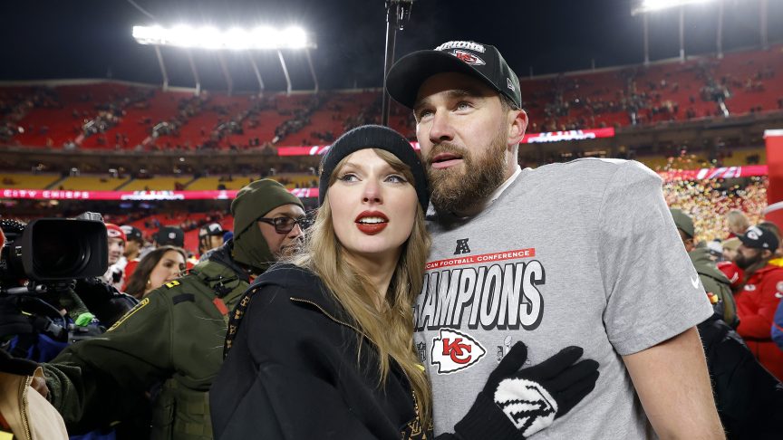 Taylor Swift celebrates with Travis Kelce #87 of the Kansas City Chiefs after defeating the Buffalo Bills 32-29 in the AFC Championship Game at GEHA Field at Arrowhead Stadium.