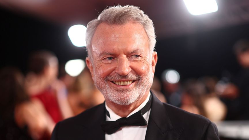 A video tribute to Jurassic Park star Sam Neill reveals him singing with costars Laura Dern and Jeff Goldblum.