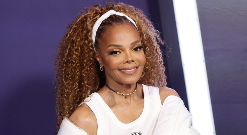 Janet Jackson on the red carpet smiling