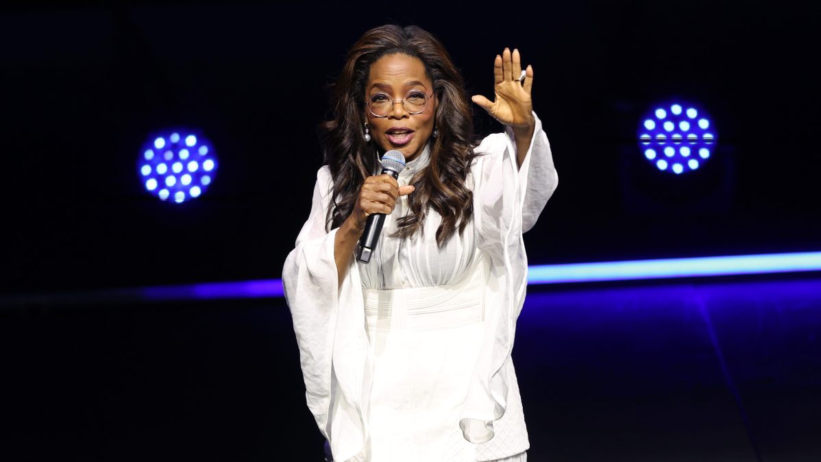 Oprah Winfrey greets the audience during the opening show of Oprah 'In Conversation' Australia 2025 tour at ICC Sydney Theatre.