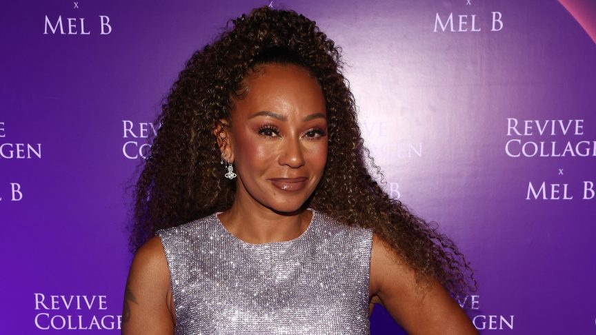 Mel B smiling on the red carpet.