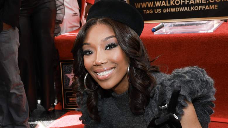 Brandy smiling by her star on the Hollywood Walk of Fame