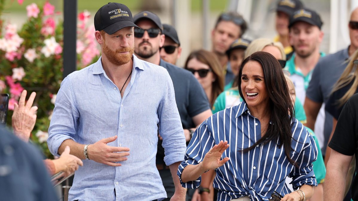 Prince Harry, Duke of Sussex, and Meghan, Duchess of Sussex greet members of the public at the Cruising Yacht Club of Australia.