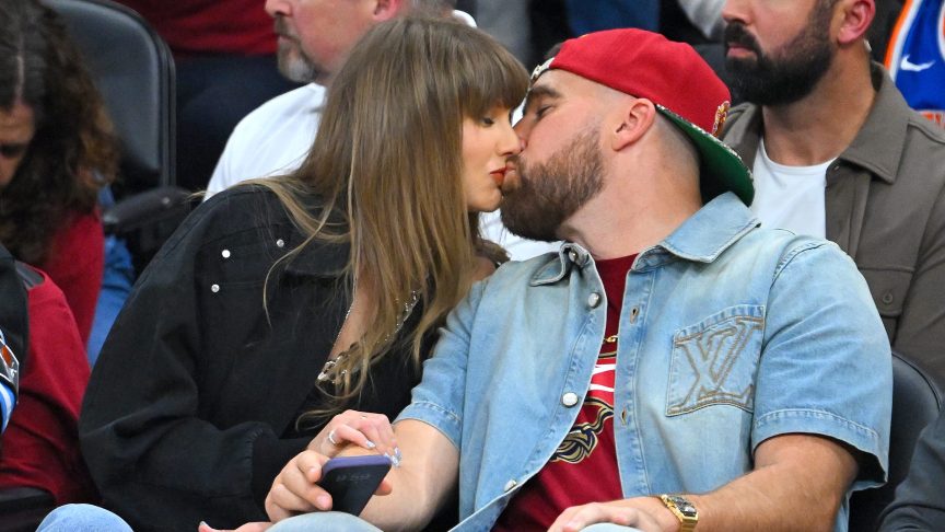 Taylor Swift and Travis Kelce kiss
