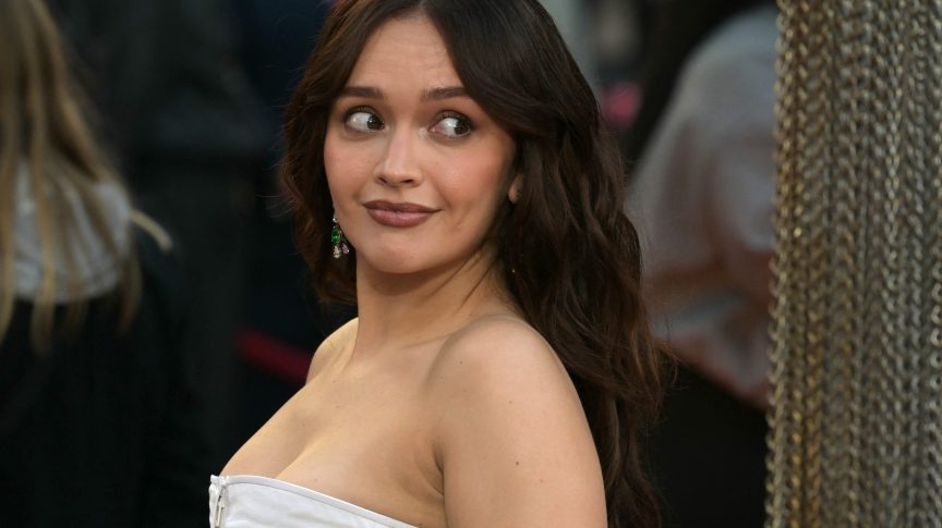 Olivia Cooke wearing a white gown at the premiere of House of the Dragon Season 3