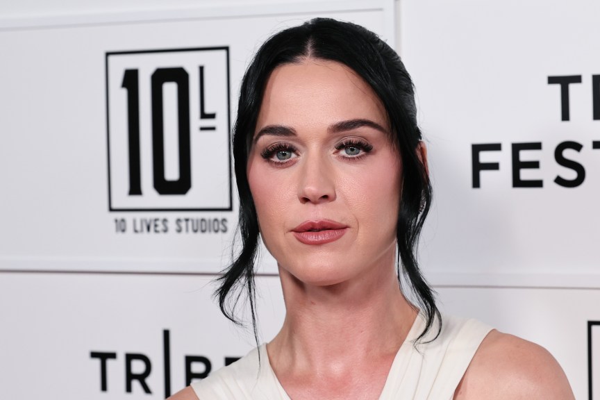 Katy Perry stares at camera in white halter dress