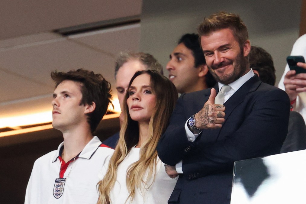 Cruz Beckham, Victoria Beckham, and Sir David Beckham watching England vs Argentina.