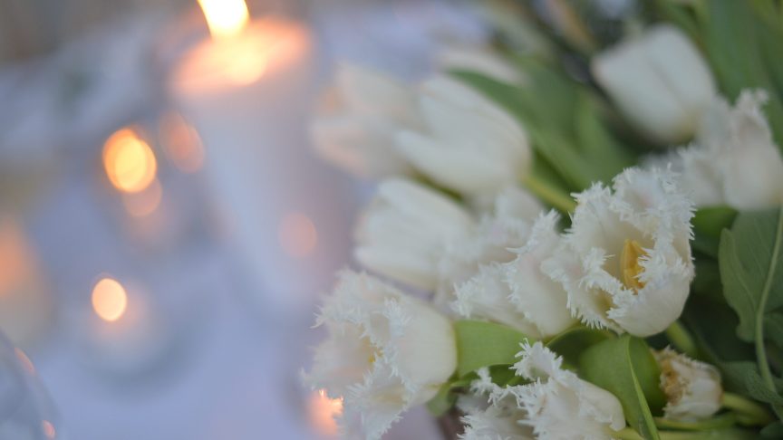 Flowers and candles for Tom Chadbon.