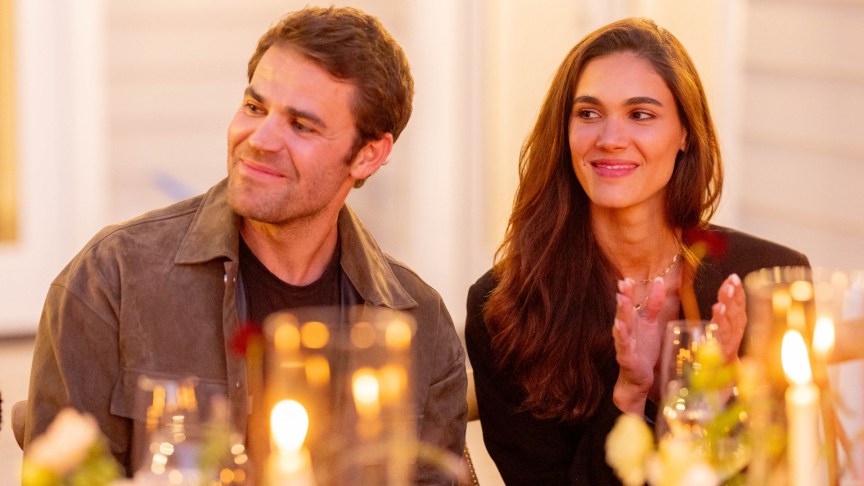 Paul Wesley sits next to Natalie Kuckenburg at a table.