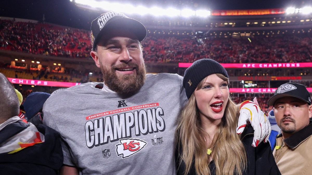 Taylor Swift and Travis Kelce celebrating on the field