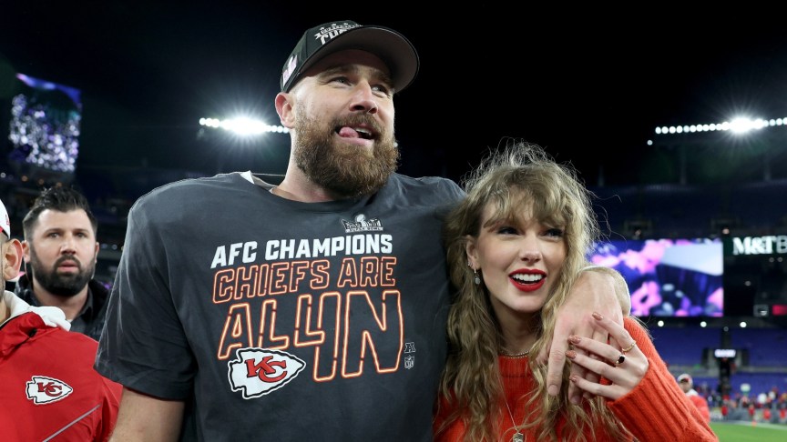 Taylor Swift and Travis Kelce celebrate on the field