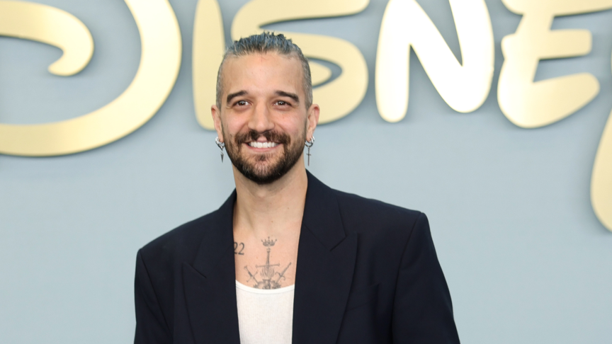 Mark Ballas smiles in white shirt and black jacket