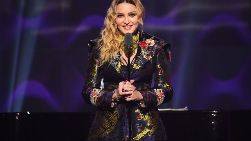 Madonna speaks on stage at the Billboard Women in Music 2016 event.