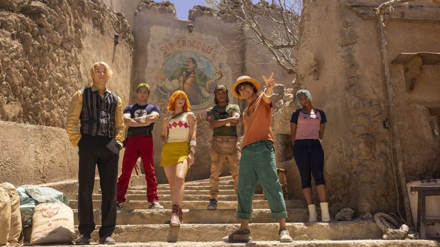 Netflix's Straw Hat Pirates behind a mural of Sir Crocodile
