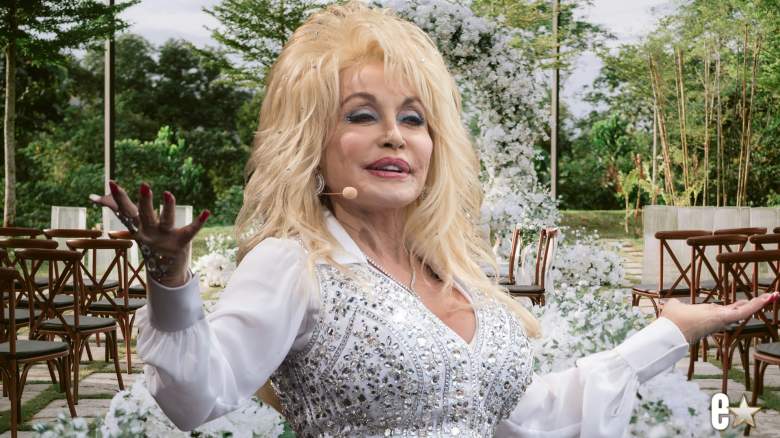 Dolly Parton with her arms open