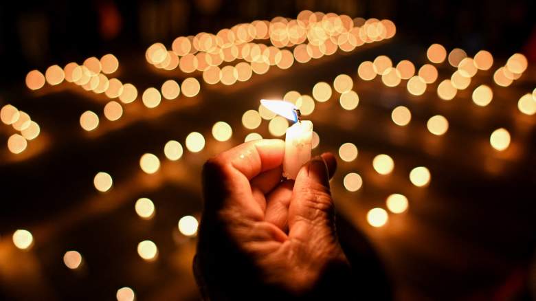 Hand holding a candle